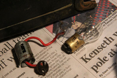 The Zundapp KS601 tail light socket and bulb as found.