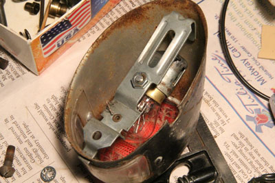 Socket and mount fitted in tail light housing.