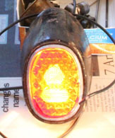 Brightness of tail light alone with reflector.